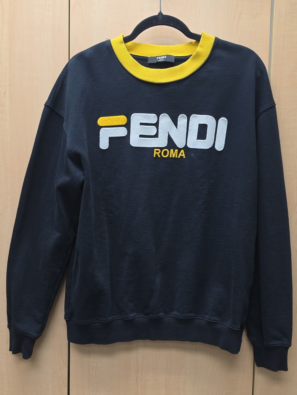Black Crewneck Sweater with Yellow Trim and White Logo